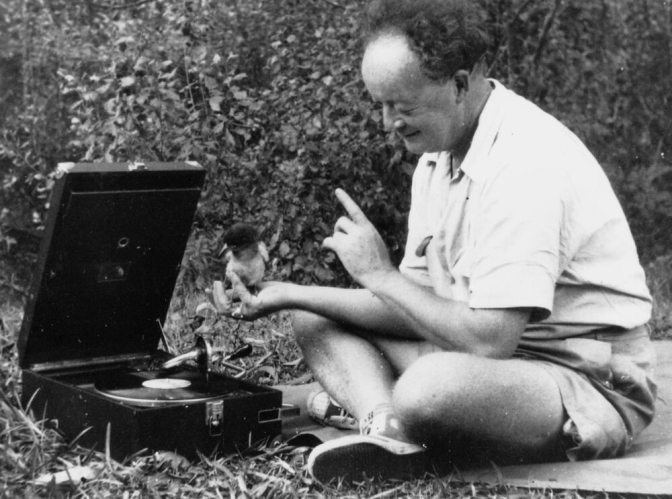 Ernest Briggs and a butcherbird listening to the gramophone