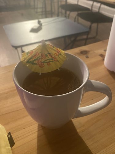 drinking coffee with a drink umbrella