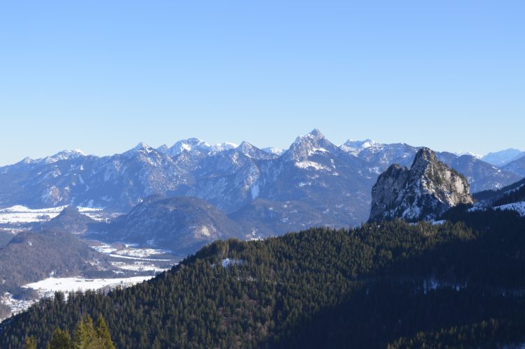 From a mountaintop in Allgäu, Germany, looking toward the German Alps. Castle Neuschwanstein is barely visible, to the center-left. Taken January 25, 2022 (Photo: Elena Scholz)